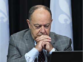 Quebec Health Minister Christian Dubé ponders a question during a news conference on the COVID-19 pandemic, Tuesday, Dec. 7, 2021 at the legislature in Quebec City.