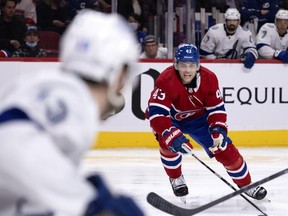 Montreal Canadiens defenseman Kale Clague (43) strains to tip the puck away during second period in Montreal on Tuesday, Dec. 7, 2021.