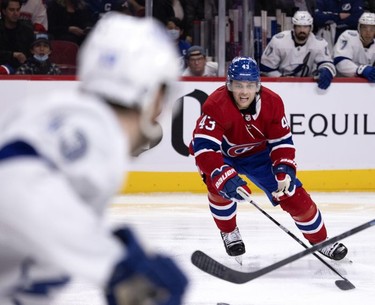 Montreal Canadiens defenseman Kale Clague (43) strains to tip the puck away during second period in Montreal on Tuesday, Dec. 7, 2021.
