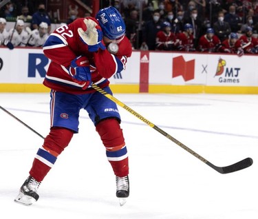 Montreal Canadiens left wing Artturi Lehkonen (62) covers up his face as the puck bounces off him during third period in Montreal, on Tuesday, Dec. 7, 2021.