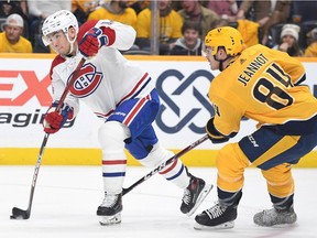 Canadiens' Nick Suzuki (14) scores against the Predators at Bridgestone Arena in Nashville on Saturday, Dec. 4, 2021.