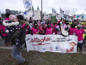 Daycare workers demonstrate to push lagging contract talks, Nov. 23, 2021, in Montreal.