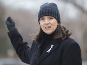 Nathalie Provost, a survivor of the Ecole Polytechnique shooting in 1989 speaks during an event in Montreal, Sunday, Dec. 6, 2020, on the 31st anniversary of the murder of 14 women in an anti-feminist attack at the university on December 6, 1989.