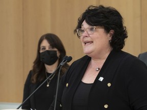 Government MNA and committee president Nancy Guillemette speaks at a news conference on the legislature committee's report on medically assisted death, Wednesday, Dec. 8, 2021 in Quebec City. Parti Québécois MNA Véronique Hivon looks on.