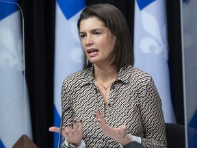 Quebec deputy premier and Public Security Minister Geneviève Guilbault responds to reporters' questions about the tabling of legislation on public security, Wednesday, Dec. 8, 2021 at the legislature in Quebec City.
