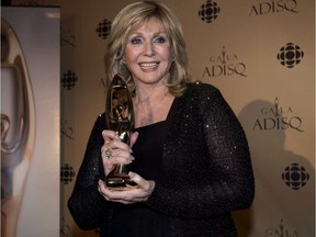 Country singer Renée Martel holds up her honourary Félix Award at the ADISQ gala awards ceremony in Montreal on Oct. 28, 2012. She died at the age of 74 on Saturday, Dec. 18, 2021, he agent announced.