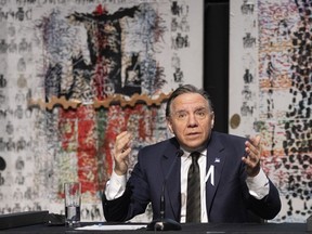 Quebec Premier François Legault responds to reporters' questions after announcing the building of a new pavilion to honour painter Jean Paul Riopelle in Quebec City.