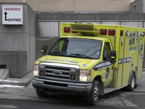 An ambulance leaves the emergency drive-thru at Notre-Dame hospital on Jan. 6, 2022.