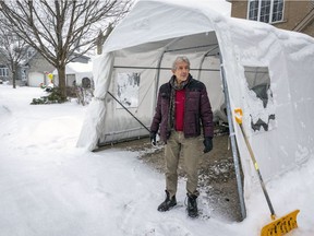 François Shalom stands next to his car shelter at his home in the Pierrefonds-Roxboro borough on Jan. 7, 2022. He installed the car shelter last winter because a heart issue no longer allowed him to shovel his driveway.