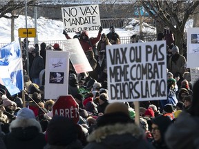 Protesters gather at Place Jacques-Cartier on Saturday Jan. 8, 2022 to denounce the government's measures surrounding the COVID-19 pandemic.