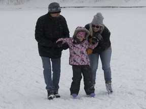 Camilla Moran, 4, gets a helping hand on her skates from grandparents Gilles Laverdiere and Claire Leblanc at Lafontaine Park on Sunday, Jan. 9, 2022. Tuesday's deep freeze will make it too risky for young children, older adults and others to spend much time outdoors.