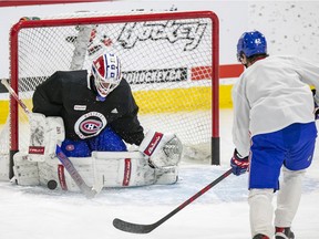 Goalie Jake Allen stops a shot by forward Lukas Vejdemo during Canadiens practice on Monday.
Allen has a 5-15-2 record with a 3.12 goals-against average and a .903 save percentage this season.