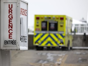 One of 5 ambulances parked at the emergency room at the Notre-Dame Hospital in Montreal on Jan. 13, 2022.