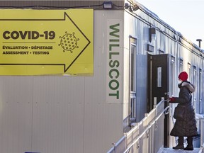 A woman enters the COVID-19 testing centre at the Jewish General Hospital in Montreal on Friday, Jan. 14, 2022.