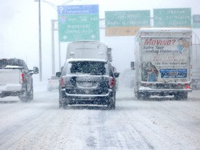 Traffic heads east on Highway 20 through the Lachine borough during a snowstorm in Montreal Jan. 17, 2022.