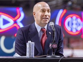 Kent Hughes smiles while answering questions at a news conference introducing him as the Montreal Canadiens new general manager at the Bell Centre in Montreal Wednesday Jan. 19, 2022.