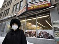 Antonia Caserta, a longtime customer, is seen outside the Slovenia butcher shop in Montreal on Wednesday, Jan. 19, 2022.