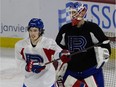 Rafaël Harvey-Pinard and goalie Kevin Poulin during a team practice in Laval, on Friday, Jan. 21, 2022.