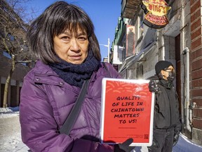 May Chiu of Progressive Chinese of Quebec displays a poster calling for the preservation of Montreal’s Chinatown.
