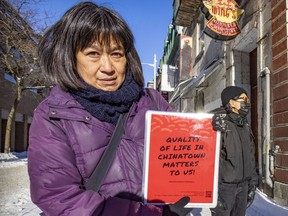 May Chiu of Progressive Chinese of Quebec displays a poster calling for the preservation of Montreal's Chinatown.
