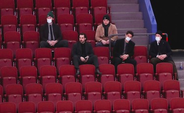 Montreal Canadiens' Jonathan Drouin, in beige, and teammates watch game against the Anaheim Ducks in an empty Bell Centre during the second period in Montreal on Thursday, Jan. 27, 2022.