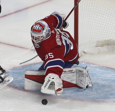 Montreal Canadiens goaltender Sam Montembeault dives on puck during third period in Montreal on Thursday, Jan. 27, 2022.