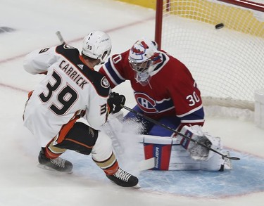 Anaheim Ducks' Sam Carrick scores on Montreal Canadiens goaltender Cayden Primeau during first-period action in Montreal on Thursday, Jan. 27, 2022.