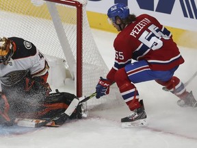 Canadiens' Michael Pezzetta (55) tries to get puck past Anaheim Ducks goaltender Anthony Stolarz in Montreal on Jan. 27, 2022.