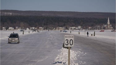 A motorist crosses the seasonal ice bridge from Oka to Hudson.