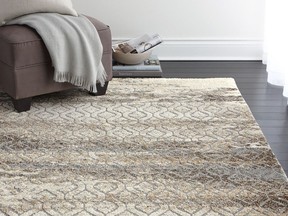 A new rug gives big impact when freshening up a living room. Hometrends' Grey Ibiza Rug, $100, Walmart