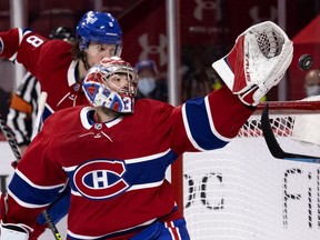 Montreal Canadiens goaltender Carey Price can't reach the puck as defenceman Ben Chiarot heads to the back of the net against the Winnipeg Jets in Montreal on June 7, 2021.