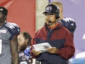 Anthony Calvillo watches from the sideline as the Alouettes' offensive coordinator during a Canadian Football League game against the Hamilton Tiger-Cats in Montreal on Friday July 15, 2016.