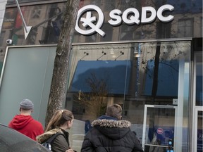 People wait outside a Quebec cannabis store in 2019.