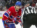 Canadiens' Nick Suzuki talks to linesman Brad Kovachik during a game this season.  Suzuki will head to Las Vegas next month for the NHL's ALL-Star Game.