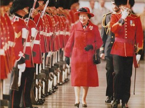 Queen Elizabeth inspects 2nd Battalion of Royal 22nd Regiment's guard of honour with Maj. Dominique James on Oct 21, 1987.