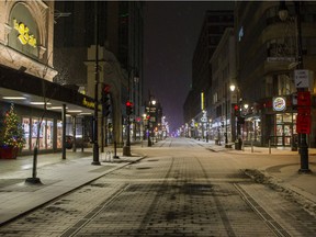 An empty  Ste. Catherine street in Montreal Saturday, January 1, 2022 after the 10:00 p.m. curfew. This was the second day of curfew to help mitigate the spread of COVID-19 coronavirus. (John Kenney / MONTREAL GAZETTE) ORG XMIT: 67220