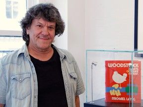 Woodstock producer Michael Lang poses during a photo exhibit that celebrates the 50th anniversary of Woodstock in New York on August 9, 2019.