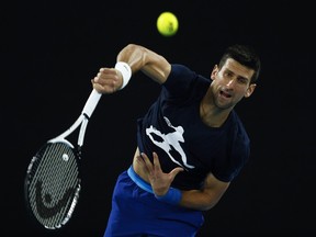 Novak Djokovic of Serbia serves during a practice session ahead of the 2022 Australian Open at Melbourne Park on Jan. 14, 2022 in Melbourne, Australia.