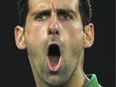 Serbia's Novak Djokovic reacts after a point against Austria's Dominic Thiem during their men's singles final match on Day 14 of the Australian Open tennis tournament in Melbourne on Feb. 2, 2020. The vaccine-skeptic tennis ace was held after arrival in Australia on Jan. 5, 2022, his visa revoked for failing to meet the country's tough pandemic restrictions.