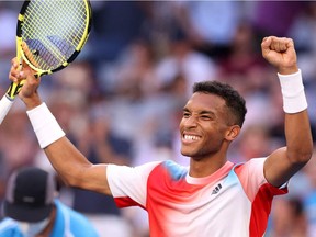 Canada's Félix Auger-Aliassime celebrates after victory against Britain's Daniel Evans during their men's singles match on day six of the Australian Open tennis tournament in Melbourne on January 22, 2022.