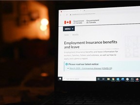 The employment insurance section of the Government of Canada website is shown on a laptop.