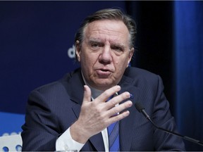 Quebec Premier François Legault responds to a question during a news conference in Montreal, Tuesday, Jan. 11, 2022.
