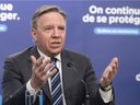 Quebec Premier François Legault speaks to the media at a COVID-19 press briefing in Montreal, Thursday, January 20, 2022.