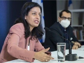 Quebec Liberal Party leader Dominique Anglade, left, speaks during a news conference as Liberal MNA Monsef Derraji looks on in Montreal, Sunday, Jan. 23, 2022.