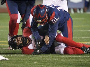 Montreal Alouettes defensive-end Nick Usher sacks Ottawa Redblacks' Caleb Evans in Montreal on Nov. 19, 2021.