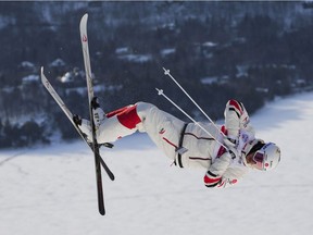 Quebec's Mikael Kingsbury jumps as he makes his way to a win in the men's freestyle  World Cup moguls at Mont-Tremblant on Saturday, Jan. 8, 2022.