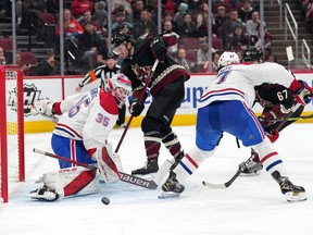 Arizona Coyotes right wing Christian Fischer (36) shoots against Montreal Canadiens goaltender Sam Montembeault (35) during the third period at Gila River Arena Monday, Jan. 17 in Glendale, Ariz.