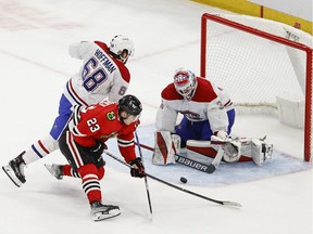 Chicago Blackhawks center Philipp Kurashev (23) scores the winning goal against the Montreal Canadiens in extra time at the United Center on January 13, 2022.