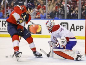 Florida Panthers' Mason Marchment (17) passes the puck in front of Canadiens goaltender Sam Montembeault during the second period at FLA Live Arena on Saturday, Jan. 1, 2021, in Sunrise, Fla.