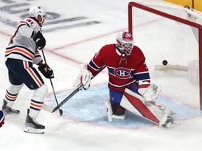 Edmonton Oilers' Evander Kane (91) scores a goal against Canadiens goaltender Sam Montembeault during the first period at the Bell Centre on Saturday, Jan. 29, 2022, in Montreal.